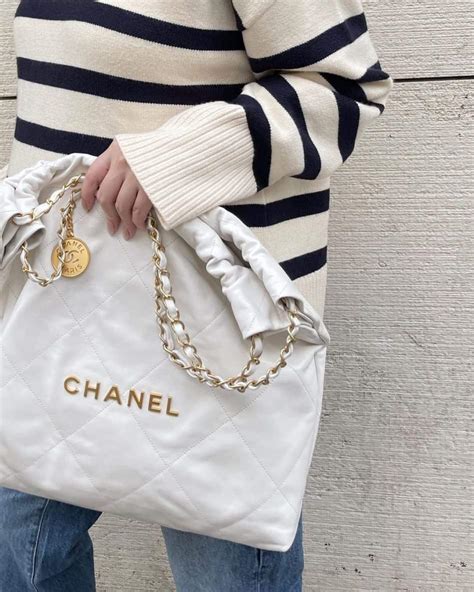 chanel purse white and black|Chanel 22 bag small price.